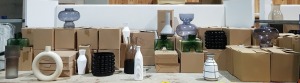 60+ BRAND NEW MIX LOT CONTAINING VARIOUS VASES IN DIFFERENT STYLES SUCH AS TRANSPARENT GLASS FLORAL VASE , BLACK GLASS BUBBLE VASE , GLASS CONCAVE VASE'S IN GREEN , OFF WHITE CEARAMIC CIRCLE VASE , NORDIC BLACK AND WHITE VASE ECT ON A FULL BAY