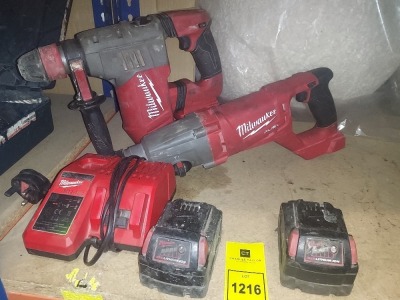 5 PIECE MILLWAKEE TOOL LOT CONTAINING 1 SDS-PLUS HAMMER WITH FIXTEC CHUCK ,1 D- HANDLE ROTARY HAMMER, TWO BATTERIES AND ONE CHARGING STATION.