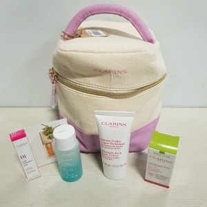 8 X BRAND NEW CLARINS PARIS GIFT SETS CONTAINING TREATMENT OIL, EYE MAKEUP REMOVER, LIP OIL AND BODY LOTION