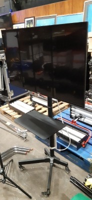 SONY BRAVIA 43 INCH 4K ULTRA HD SMART GOOGLE TV - MODEL NUMBER KD - 43XE8004 (NOTE: SCRATCH ON LEFT SIDE OF SCREEN) - ON A MOBILE TV STAND