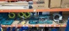 1 X MIXED MAKITA TOOL LOT CONTAINING 110 VOLT MAKITA CIRCLULAR SOLE, MAKITA ANGLE GRINDER, MAKITA DRILL, 3 X 10M EXTENSION LEADS, VARIOUS MAKITA DRILL BITS AND SCREWDRIVER BITS, DEEP SOCKET ETC. ON A FULL SHELF