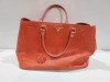 1 X ORANGE COLOURED LEATHER LIKE HAND BAG ( PRADA BRANDED - NO SERIAL NUMBER FOUND )