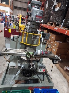 BRIDGEPORT TURRET MILLING MACHINE WITH 48 BED AND VARIABLE SPEED HEAD,SN/720542, 3 PHASE, CYCLES 50/60, DIGITAL READOUT, SPILL SHELF AND ASSOCIATED TOOLING