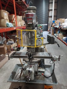 BRIDGEPORT MILLING MACHINE WITH 42 BED AND VARIABLE SPEED HEAD, TYPE - TVY, S/N 1-55-0100, CYCLES 50/60,3 PHASE, DIGITAL READOUT, SPILL SHELF AND ASSOCIATED TOOLING