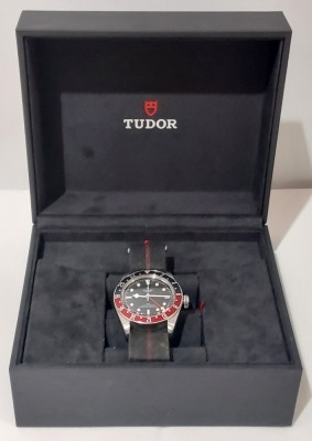 TUDOR BLACK BAY GMT WRIST WATCH WITH BLACK & RED FABRIC STRAP M113565 - TUDOR01 - SAP 51433.04 SERIAL NUMBER I763923. IN PRESENTATION BOX WITH BOOKLETS ORIGINAL RETAIL PRICE STATED AS 2,570.00