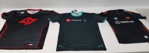 23 X BRAND NEW MIXED CLOTHING LOT CONTAINING 18 X IMMORTALS - PRO JERSEY 2021 IN GREEN WITH MIXED SPONSORSHIP BRANDING IN SIZE LARGE - 4 X FNATIC PRO JERSEY 2021 IN BLACK/ BLUE WITH MIXED SPONSORS SIZE SMALL - 1 CLG PRO JERSEY 2021 BLACK/RED IN SIZE XXL 