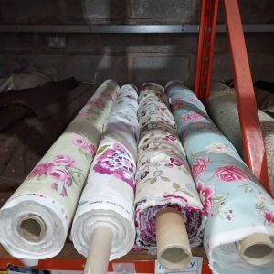 4 X BRAND NEW MIXED CURTAIN FABRIC ROLL LOT CONTAINING - 1 IN VINTAGE FLOWER DESIGN IN BLUE APPROX 20M LENGTH - 1 IN ROSA DESIGN IN CREAM APPROX 20M LENGTH - 1 IN FIJI DESIGN IN WHITE APPROX 20M LENGTH - 1 IN NANCY DESIGN IN GREEN APPROX 20M LENGTH - APPR