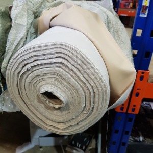 1 X ROLL OF CREAM COLOURED LEATHER LOOK FABRIC - APPROX 40 M LENGTH