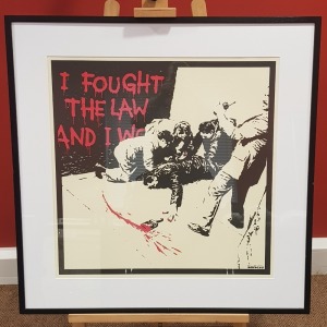 BANSKY SCREENPRINT IN BLACK AND RED ON WHITE PAPER ARTISTS PROOF - I FOUGHT THE LAW SIGNED AND NUMBERED 26 IN PENCIL LOWER RIGHT 26 X 26 INCH (66 X 66CM) (THE IMAGE)