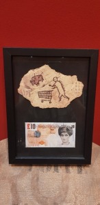 BANKSY RE-PRINTED COPY OF DI-FACED TENNER FRAMED TOGETHER WITH PECKHAM ROCK WOODEN POSTCARD