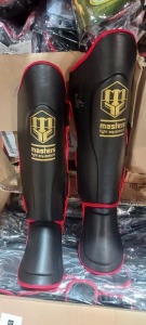 57 X BRAND NEW MASTERS FIGHT EQUIPMENT COMBAT SHIN GUARDS IN MIXED SIZES 34 IN M AND 26 IN L IN 7 BOXES