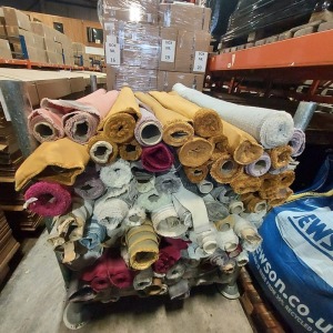 APPROX 120 ROLLS OF VARIOUS COLOUR AND STYLES OFFCUT FABRICS - ON A METAL STILLAGE ( NOT INCLUDED )