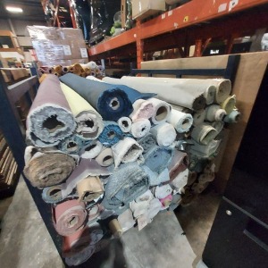 APPROX 120 ROLLS OF VARIOUS COLOUR AND STYLES OFFCUT FABRICS - ON A METAL STILLAGE ( NOT INCLUDED )