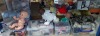 FULL 2 SHELFS BRAND NEW MIXED LOT CONTAINING DRESSED DOLLS IN VARIOUS SIZES - VARIOUS KNITTED BABY CLOTHING - WOOL IN VARIOUS COLOURS AND SIZES - VARIOUS BAGS - BASKET - BLANKETS - WOODEN BABY ROCKER ETC (SEE BOTH IMAGES) - 2