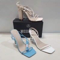 15 X MIXED MISSGUIDED WOMENS SHOES CONTAINING WF BARELY THERE MID HEEL SANDAL IN WHITE , SQUARE TOE TIE UP HEELED SANDAL IN BLUE , BARELY THERE LOW HEEL SANDAL IN WHITE , BLOCK HEEL TIE UP SANDAL IN CREAM ETC ALL IN SIZE 7 (NOTE - SOME HAVE SECURITY TAGS)