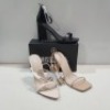 15 X MIXED MISSGUIDED WOMENS SHOES CONTAINING ENTRY BLOCK HEELED SANDAL IN BLACK , POINTED TOE PATENT BARELY THERE IN NUDE , SQUARE TOE HIGH HEEL TIE UP SANDAL IN SAND ETC ALL IN SIZE 6 (NOTE - SOME HAVE SECURITY TAGS)
