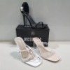15 X MIXED MISSGUIDED WOMENS SHOES CONTAINING SQUARE TOE PATENT HEELED SANDAL IN BLACK , WF MID ILLUSION HEEL CLEAR SANDAL IN NUDE , POINTED TOE PERSPEX STILETTO IN NUDE , STRAPPY RING DETAIL HEELED SANDAL IN WHITE ETC ALL IN SIZE 6 (NOTE - SOME HAVE SECU