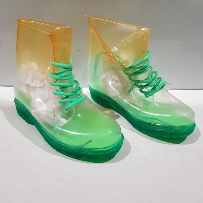 24 X BRAND NEW CLEAR WELLY BOOTS IN ORANGE / GREEN IN MIXED SIZES, 2 X SIZE 4, 3 X SIZE 5, 3 X SIZE 6, 3 X SIZE 7 & 1 X SIZE 8 IN TWO BOXES.