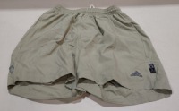 20 X ADIDAS KIDS SHORTS IN LIGHT GREEN IN VARIOUS SIZES I.E M, L, XL IN 1 TRAY (TRAY NOT INCLUDED)