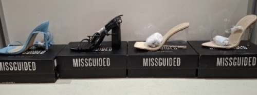20 X BRAND NEW PAIRS OF ASSORTED MISSGUIDED WOMENS SHOES CONTAINING POINTED TOE PERSPEX STILETTO IN NUDE , PERSPEX SQUARE TOE WEDGE HEEL IN NUDE , BLOCK HEEL TIE UP SANDALS IN BLACK , SQUARE TOE TIE UP HEELED SANDALS IN BLUE ETC ALL IN SIZE 4 (NOTE - SOME
