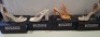 20 X BRAND NEW PAIRS OF ASSORTED MISSGUIDED WOMENS SHOES CONTAINING SQUARE TOE PATENT HEELED SANDAL IN SAND , STRAPPY RING DETAIL HEELED SANDAL IN ORANGE , BLOCK HEEL TIE UP HEELED SANDALS IN CREAM , HIGH HEEL BLOCK BARELY THERE SANDALS IN SAND ETC ALL IN