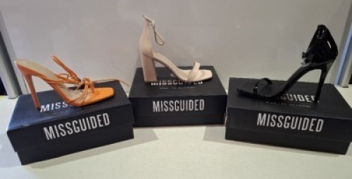20 X BRAND NEW PAIRS OF ASSORTED MISSGUIDED WOMENS SHOES CONTAINING STRAPPY RING DETAIL HEELED SANDAL IN ORANGE , HIGH HEEL BLOCK BARELY THERE SANDALS IN SAND , SQUARE TOE PATENT HEELED SANDAL IN BLACK ETC ALL IN SIZE 4 (NOTE - SOME HAVE SECURITY TAGS)