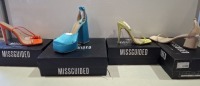 20 X BRAND NEW PAIRS OF ASSORTED MISSGUIDED WOMENS SHOES CONTAINING MID HEEL BLOCK BARELY THERE IN SAND , SATIN BARELY THERE HIGH HEEL IN LIME , SQUARE TOE TIE UP HEELED SANDALS IN ORANGE , EXTREME PLATFORM SATIN HEELED SHOE IN BLUE ETC IN MIXED SIZES 3 A