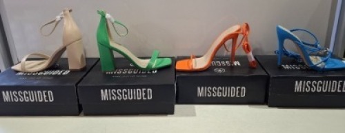 20 X BRAND NEW PAIRS OF ASSORTED MISSGUIDED WOMENS SHOES CONTAINING STRAPPY RING DETAIL HEELED SANDALS IN BLUE , SQUARE TOE TIE UP HEELED SANDALS IN ORANGE , BARELY THERE HIGH BLOCK HEEL IN GREEN , WF HIGH HEEL BLOCK BARELY THERE SANDALS IN SAND ETC IN MI