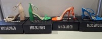 20 X BRAND NEW PAIRS OF ASSORTED MISSGUIDED WOMENS SHOES CONTAINING STRAPPY RING DETAIL HEELED SANDALS IN BLUE , SQUARE TOE TIE UP HEELED SANDALS IN ORANGE , BARELY THERE HIGH BLOCK HEEL IN GREEN , WF HIGH HEEL BLOCK BARELY THERE SANDALS IN SAND ETC IN MI