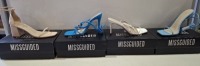 20 X BRAND NEW PAIRS OF ASSORTED MISSGUIDED WOMENS SHOES CONTAINING BARELY THERE LOW HEEL SANDALS IN WHITE , STRAPPY RING DETAIL HEELED SANDAL IN BLUE , SQUARE TOE TIE UP HEELED SANDALS IN BLUE , MID HEEL BLOCK BARELY THERE IN SAND ETC IN MIXED SIZES 4 , 