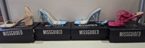 20 X BRAND NEW PAIRS OF ASSORTED MISSGUIDED WOMENS SHOES CONTAINING CROCHET TIE UP HEELED SANDAL IN HOT PINK , SQUARE TOE TIE UP HEELED SANDALS IN BLUE , HIGH HEEL BLOCK BARELY THERE SANDALS IN SAND , EXTREME PLATFORM SATIN HEELED SHOE IN BLUE ETC IN MIXE