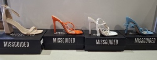 20 X BRAND NEW PAIRS OF ASSORTED MISSGUIDED WOMENS SHOES CONTAINING ASSYM STRAPPY HEELED SANDAL IN ORANGE , SQUARE TOE TIE UP HEELED SANDALS IN BLUE , STRAPPY RING DETAIL HEELED SANDAL IN WHITE , HIGH HEEL BLOCK BARELY THERE SANDALS IN SAND ETC IN MIXED S