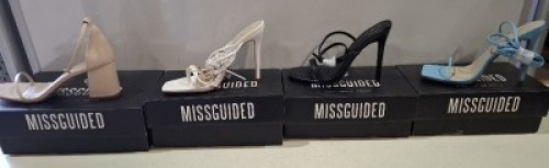 20 X BRAND NEW PAIRS OF ASSORTED MISSGUIDED WOMENS SHOES CONTAINING STRAPPY RING DETAIL HEELED SANDAL IN WHITE , MID HEEL BLOCK BARELY THERE IN SAND , SQUARE TOE TIE UP HEELED SANDALS IN BLUE , BASIC BARELY THERE IN BLACK ETC IN MIXED SIZES 6 AND 7 (NOTE 
