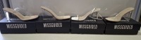 20 X BRAND NEW PAIRS OF ASSORTED MISSGUIDED WOMENS SHOES CONTAINING WIDE FIT HEEL BLOCK IN NUDE , PERSPEX SQUARE TOE WEDGE HEEL IN NUDE , BARELY THERE LOW HEEL SANDALS IN WHITE , WF MID ILLUSION HEEL CLEAR SANDALS IN NUDE ETC IN MIXED SIZES 6 AND 7 (NOTE