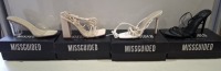 20 X BRAND NEW PAIRS OF ASSORTED MISSGUIDED WOMENS SHOES CONTAINING WF SATIN POINTED LACED UP BARELY THERE IN BLACK , STRAPPY RING DETAILED HEELED SANDALS IN WHITE , BLOCK HEEL TIE UP HEELED SANDALS IN CREAM , WIDE FIT MID CLEAR HEEL BLOCK IN NUDE ETC IN 