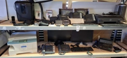 25 X MIXED OFFICE EQUIPMENT LOT CONTAINING SAMSUNG MONITOR DELL MONITOR , HP SMART TANK PLUS 555 SCANNER PRINTER , SAMSUNG OFFICE PHONE , AIPTEK DIGITAL CAMERA RECORDER LUMIE LARGE DESKTOP LIGHT ETC ON TWO SHELVES