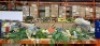 LARGE AMOUNT OF MIXED GARDEN LOT CONTAINING VARIOUS WREATHS IN YELLOW , GREEN , FLORAL , SOLAR POWERED GARDEN BUNNY LIGHTS , BATTERY POWERED EASTER LIGHTS WITH RABBIT AND EASTER EGGS ETC ON A FULL BAY