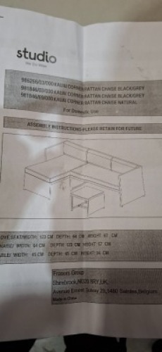 1 X STUDIO KAUAI CORNER SET RATTAN CHAISE IN BLACK / GREY LOT CONTAINING LOVE SEAT IN SIZE W 123 X D 64 X H 67 AND CHAISE IN SIZE W 64 X D 123 X H 67 AND TABLE IN SIZE 45 X D 45 X H34 CM IN ONE BOX (NOTE DAMAGED BOX / CUSTOMER RETURNS)