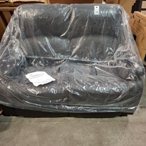 1 X HOMELIFE TWO-SEATER SOFA IN BLACK LEATHER LOOK IN SIZE L 140 X W 90 X H 101 - 78CM (CUSTOMER RETURNS )