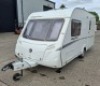 SWIFT FREESTYLE 460 TWO-BERTH TOURING CARAVAN YOM: 2009, ALL KEYS & FOBS, SINGLE AXLE. TOTAL AREA 14 M/2. REAR BATHROOM WITH SEPARATE SHOWER, MOTOR MOVER WITH REMOTE, BLOWN AIR HEATING SYSTEM, KITCHEN AREA WITH SINK, GAS HOB & COOKER, FRIDGE FREEZER, SANY - 2