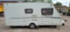SWIFT FREESTYLE 460 TWO-BERTH TOURING CARAVAN YOM: 2009, ALL KEYS & FOBS, SINGLE AXLE. TOTAL AREA 14 M/2. REAR BATHROOM WITH SEPARATE SHOWER, MOTOR MOVER WITH REMOTE, BLOWN AIR HEATING SYSTEM, KITCHEN AREA WITH SINK, GAS HOB & COOKER, FRIDGE FREEZER, SANY - 7