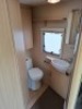 SWIFT FREESTYLE 460 TWO-BERTH TOURING CARAVAN YOM: 2009, ALL KEYS & FOBS, SINGLE AXLE. TOTAL AREA 14 M/2. REAR BATHROOM WITH SEPARATE SHOWER, MOTOR MOVER WITH REMOTE, BLOWN AIR HEATING SYSTEM, KITCHEN AREA WITH SINK, GAS HOB & COOKER, FRIDGE FREEZER, SANY - 18