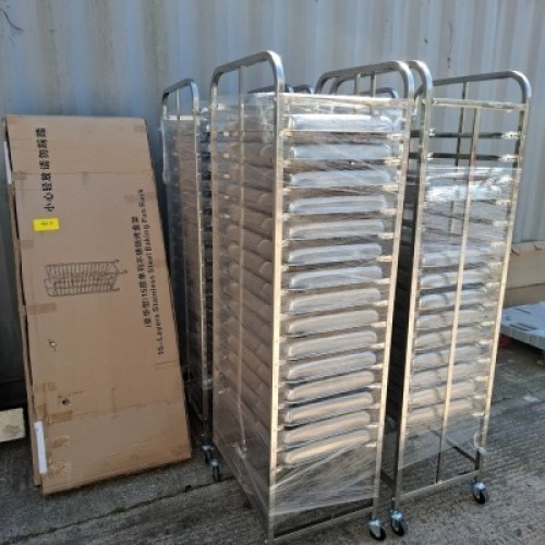 6 X ALUMINIUM / STAINLESS STEEL FOOD / BAKING RACKS / TROLLIES IE. 4 X ASSMEBLED TROLLIES 53 X STAINLESS STEEL TRAYS 2 X BRAND NEW TROLLIES