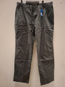 40 X BRAND NEW MIXED CLOTHING LOT CONTAINING UNDER ARMOUR POLO TOP IN WHITE IN SIZE XS , COLUMBIA PANTS IN GRAPHITE ALL IN SIZE 38 IN TWO TRAYS (NOTE TRAYS NOT INCLUDED)