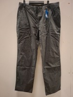 40 X BRAND NEW MIXED CLOTHING LOT CONTAINING UNDER ARMOUR POLO TOP IN WHITE IN SIZE XS , COLUMBIA PANTS IN GRAPHITE ALL IN SIZE 38 IN TWO TRAYS (NOTE TRAYS NOT INCLUDED)