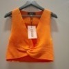 40 X BRAND NEW MISSGUIDED CLOTHING LOT CONTAINING KNOT FRONT CROP TOP CO-ORD IN ORANGE ALL IN SIZE SMALL IN TWO TRAYS (NOTE - TRAYS NOT INCLUDED)