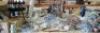 30 + BRAND NEW MIXED GARDEN LOT CONTAINING 360 DEGREES METAL SWIVEL CLASSICAL WIND SPINNERS IN BROWN / BLUE , OWL STATUE FIGURINES , ARTIFICIAL HANGING FLOWER BASKET , THE OUTDOOR CITRONELLA TORCH OIL ETC ON A FULL BAY