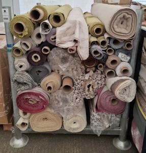 APPROXIMATELY 50 PART ROLLS OF FABRIC IN VARIOUS SIZES AND COLOURS AND STYLES IN A FULL METAL CRATE ( STILLAGE NOT INCLUDED)