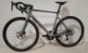 SCOTT ADDICT RC 15 IN GREY ROAD BIKE MODEL: 290358 SIZE: L - 56 ORIG PRICE: &pound;6199 ADDICT RC DISC HMX CARBON FRAME ADDICT RC HMX FORK SHIMANO ULTEGRA DI2 DISC 12 SPEED SYNCROS CAPITAL 1.0 35 DISC WHEELS SCHWALBE ONE RACE-GUARD TYRES SYNCROS CARBON/ALLO - 2