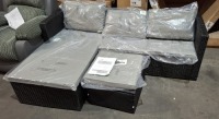 1 X BRAND NEW STUDIO BALI CORNER RATTAN SOFA IN BLACK TO INCLUDE SOFA IN SIZE W 128 X D 64 X H 61CM AND ONE TABLE / FOOT STOOL IN SIZE W 50 X 50 X H 30 CM (NOTE PRE - BUILT)